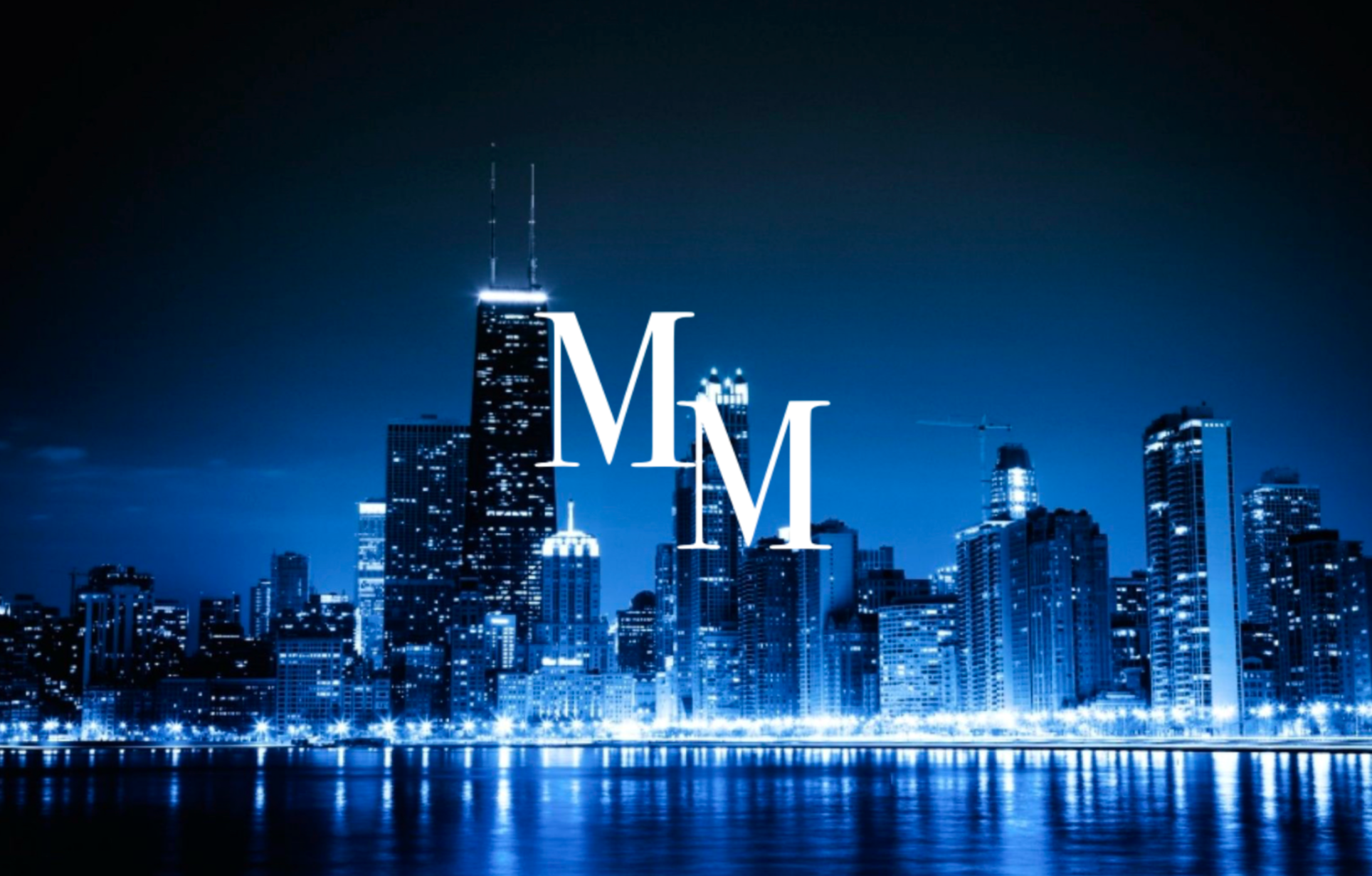 City skyline at night with illuminated letters 'MM' in the foreground